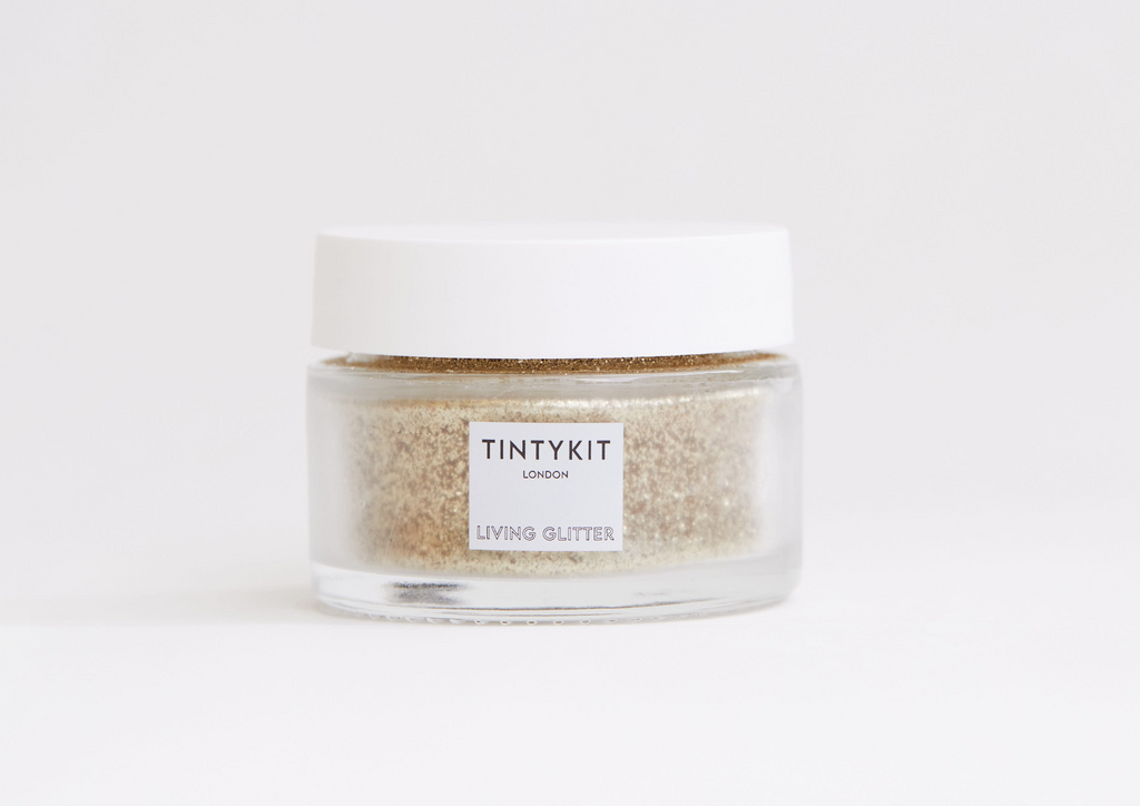 Product image of TINTYKIT LIVING GLITTER biodegradable glitter. Product variant: Gold Stardust. Front view.