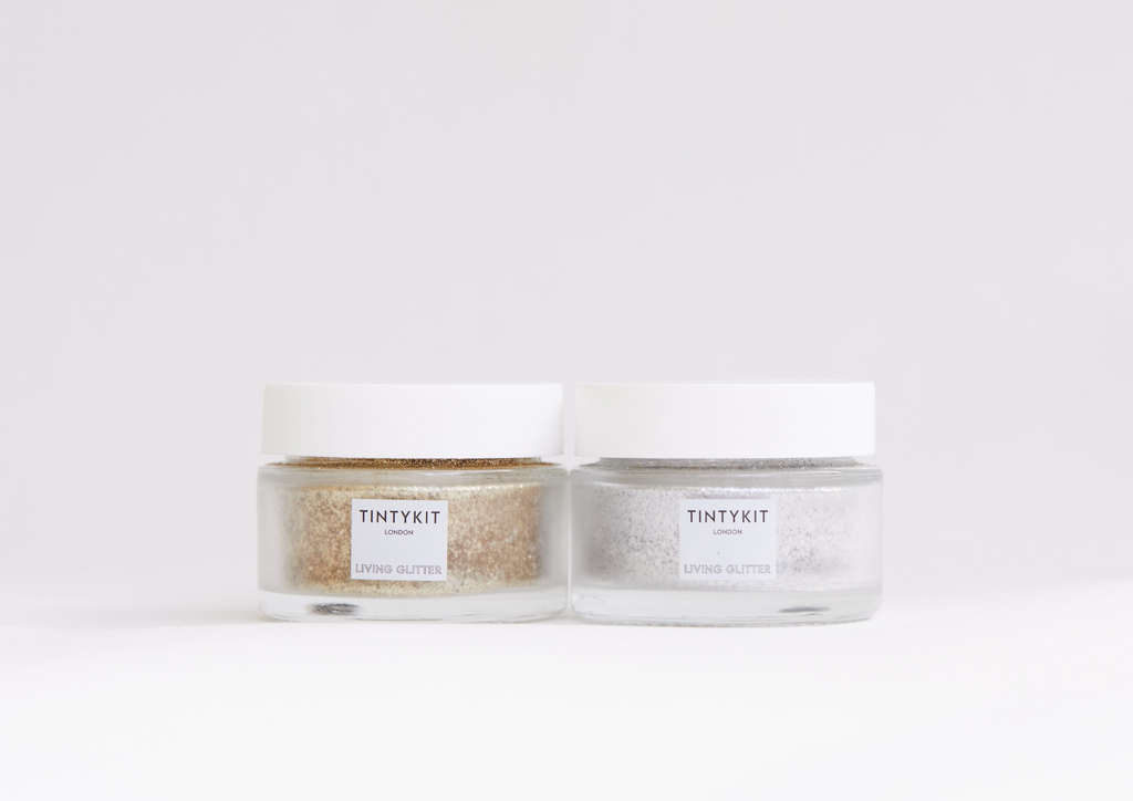 Product image of TINTYKIT LIVING GLITTER biodegradable glitter. Two jars side by side.